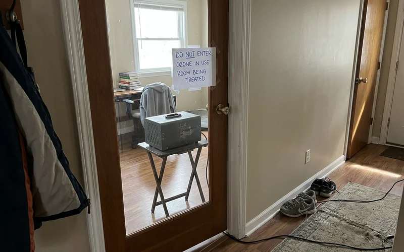 Ozone generator running in a vacated room with warning signage