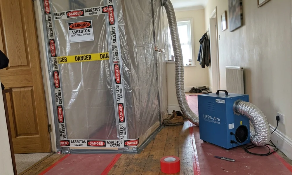 Sealed containment with negative air installed before asbestos removal